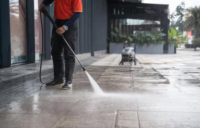 cleaning-staff-hoses-portable-car-washing-concrete-floor-with-highpressure-water-jets